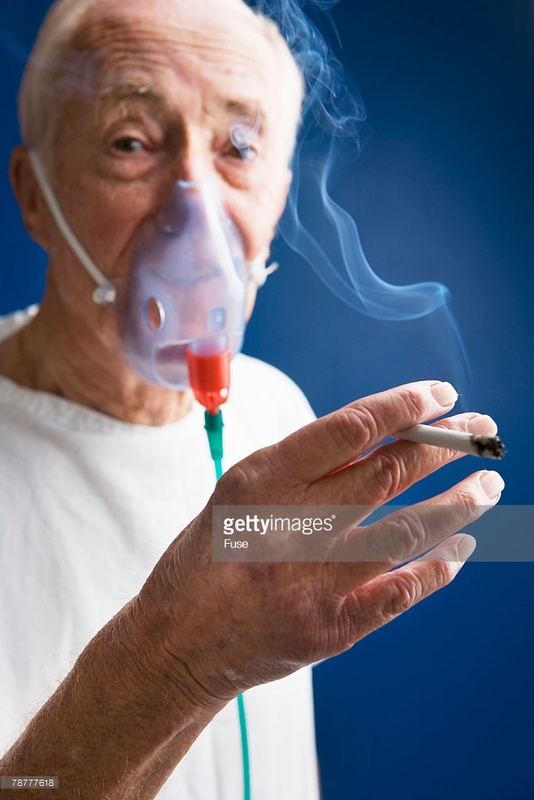 .com%2Fphotos%2Felderly-patient-wearing-oxygen-mask-and-smoking-cigarette-picture-id78777618&f=1.jpg