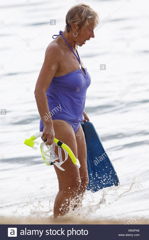 helen-mirren-helen-mirren-goes-snorkeling-in-hawaii-wearing-a-purple-K6GPA6.jpg