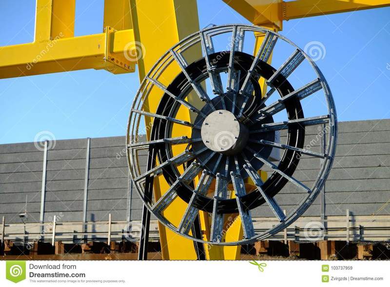 large-cable-spool-under-crane-high-power-construction-site-103737959.jpg