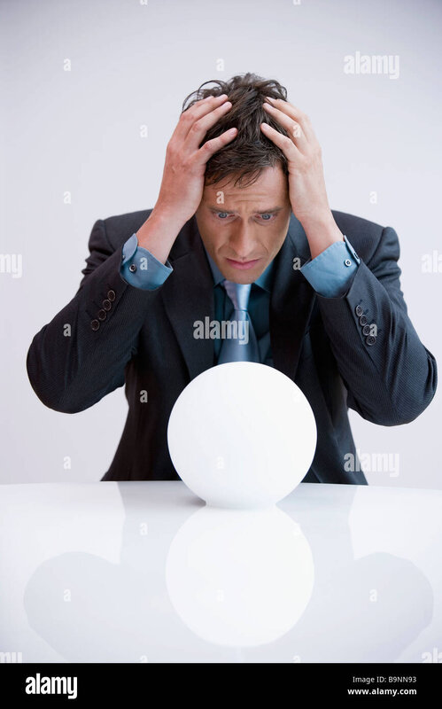 portrait-of-businessman-shocked-by-look-into-crystal-ball-B9NN93.jpg