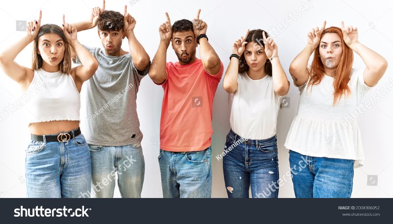 stock-photo-group-of-young-friends-standing-together-over-isolated-background-doing-funny-gest...jpg