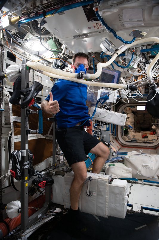 Thomas_on_Space_Station_exercise_bike_pillars.jpg