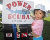 Cute Kid and Power Scuba Sign.jpg