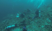 Divers lying on reef.jpg