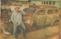 JALOPY OLD CAR TEXAN SITTING ON IT DRINKING BEER.JPG