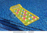 stock-photo-a-lilo-or-inflatable-air-bed-on-the-side-of-a-swimming-pool-3231833.jpg