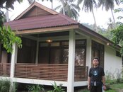 A TOURIST IN FRONT OF ONE OF THE BUNGALOWS AT LUMBA LUMBA. HE'S HEADING FOR LUNCH DURING SURFACE.JPG
