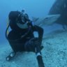 Beneath blue water diver