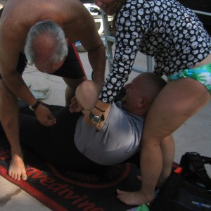 Quadriplegic diver being suited up