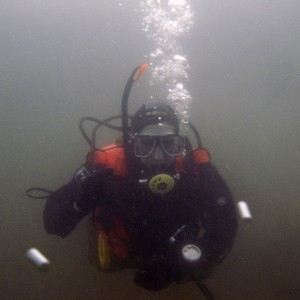 A diver wearing a PADI tube on her mask!  Rare for the UK!