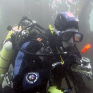 Diver about to take a photo on the James Eagan Layne