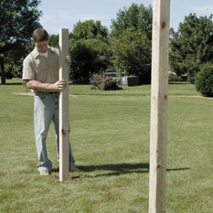 Installing-wooden-fence-posts