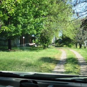 turn into the driveway of the house with the barn