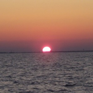Sunset over Atlantic Beach, NC from dive boat Outrageous V on the way home