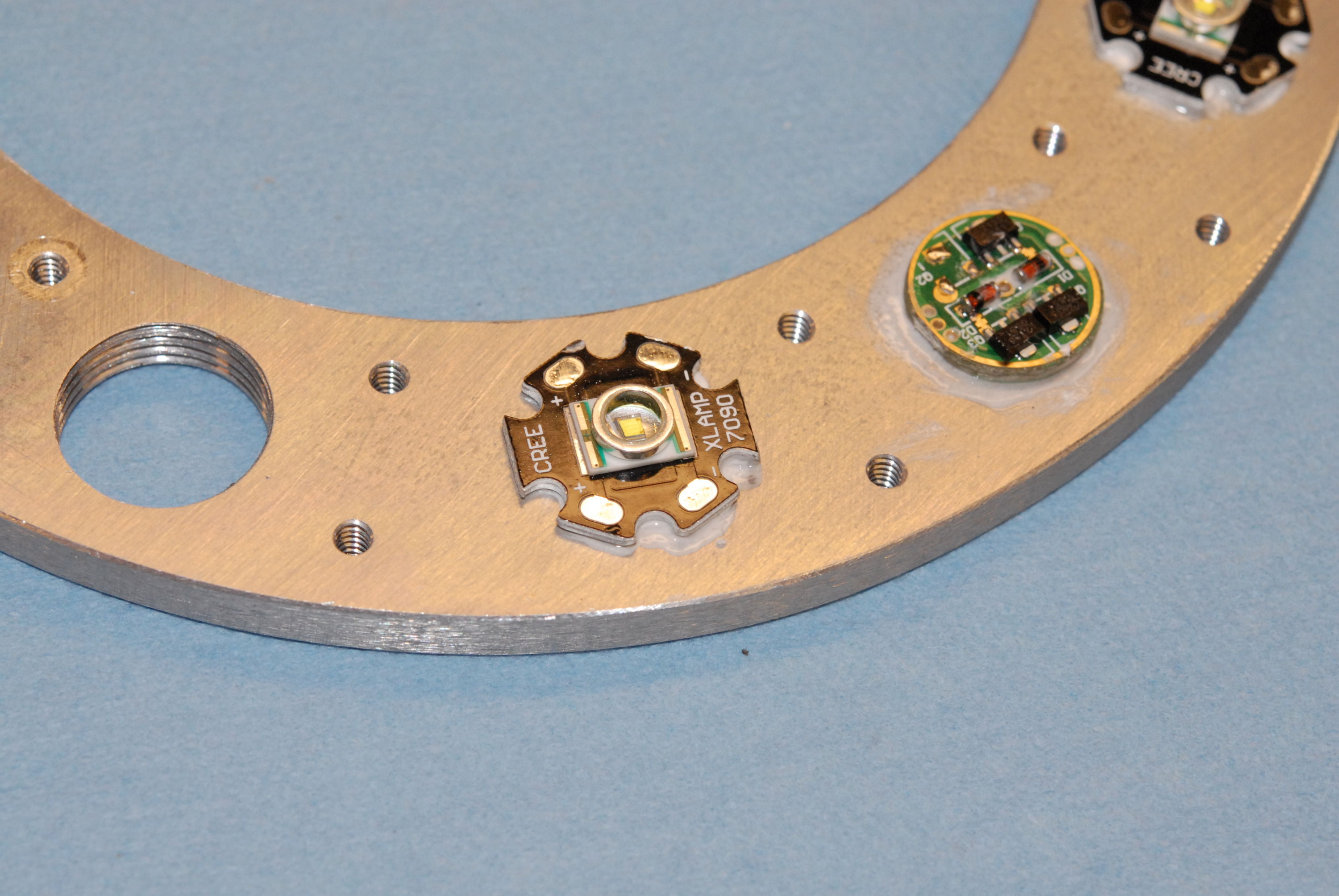 Backer ring with LED and regulator