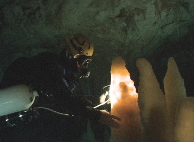 Brian Kakuk shining his MR11 on a Crystal Stalagmite