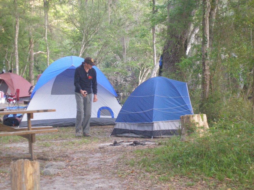 David ties Andy's tent