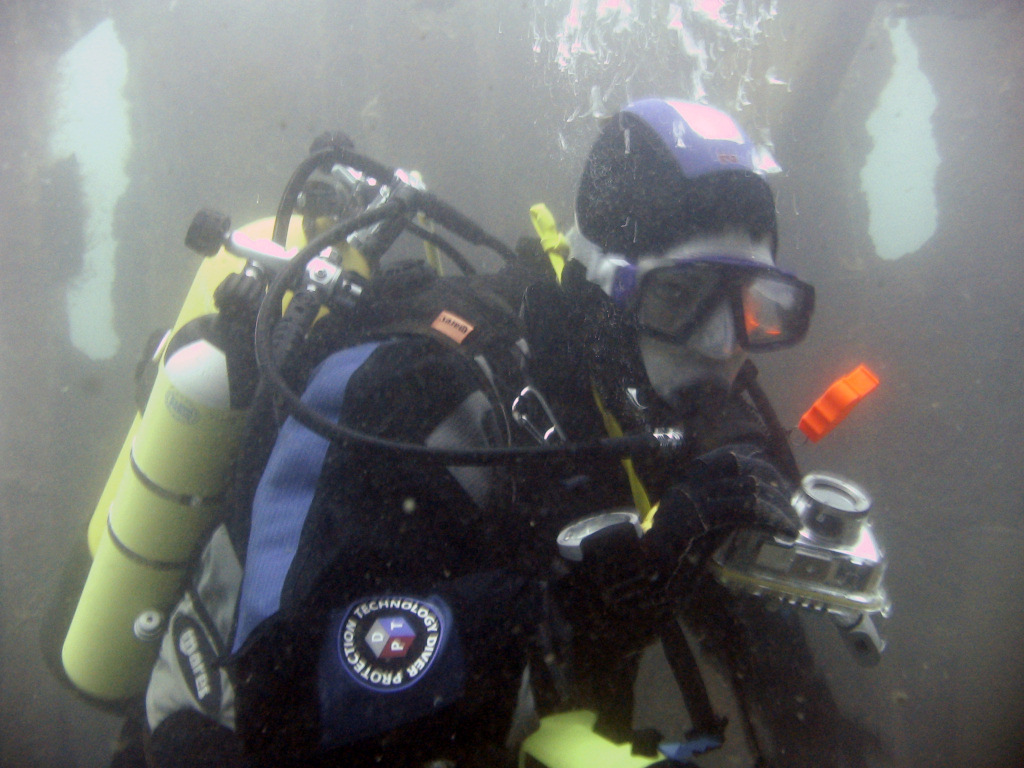 Diver about to take a photo on the James Eagan Layne