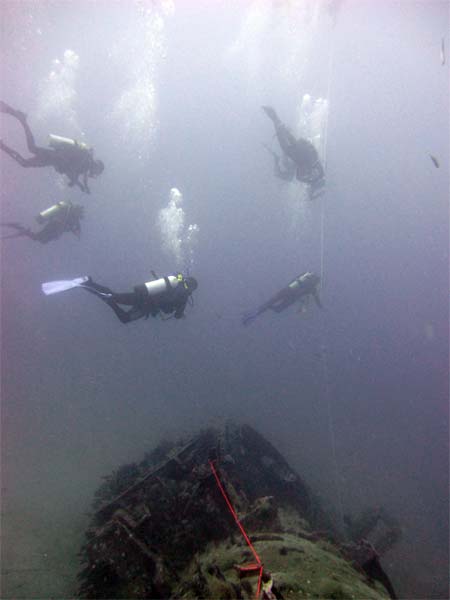 Divers above ballast tank