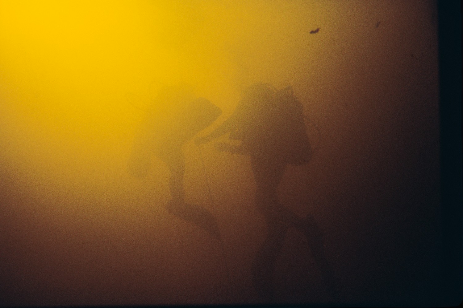 fellow divers descend into Hudson Grotto