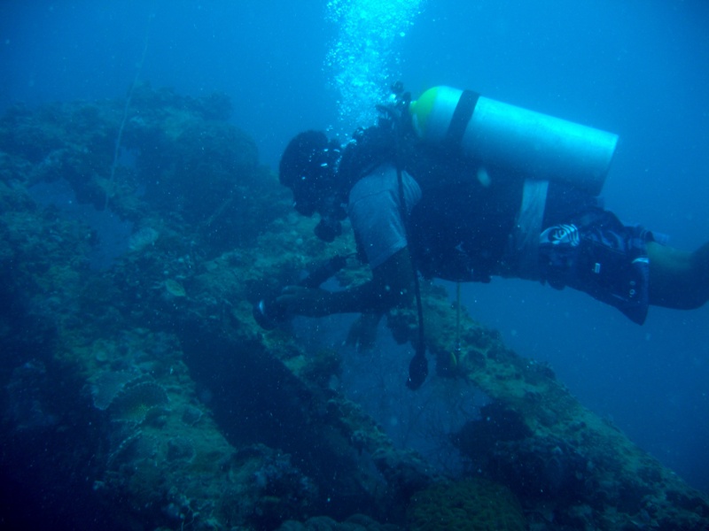 Francis looking in the hold of a ship he found in Palau.