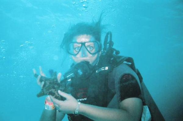 Me with a starfish in Cancun.