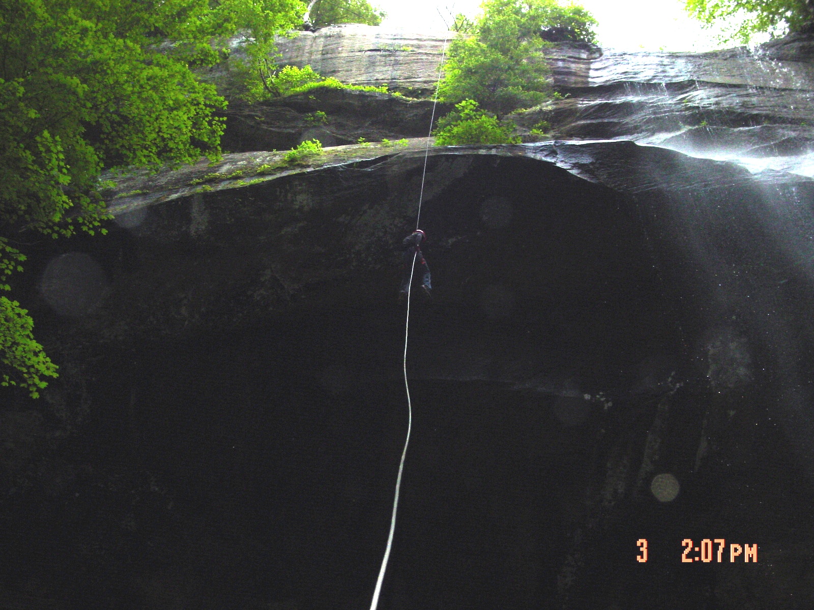 Rappelling next to the water fall