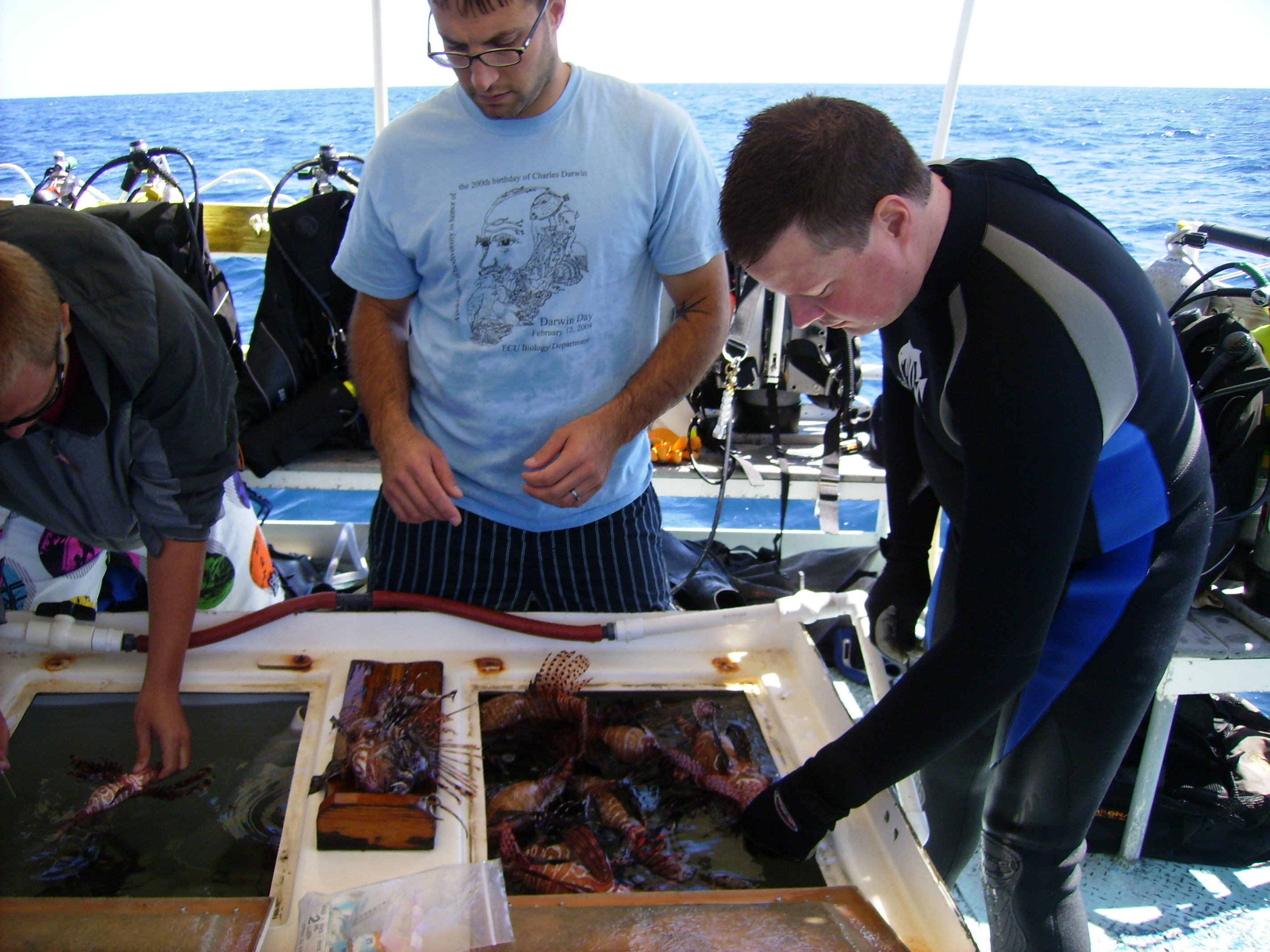 Steve Broadhurst and NOAA scientist deompressing lionfish swim bladders