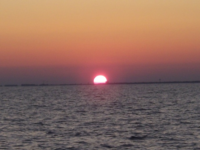 Sunset over Atlantic Beach, NC from dive boat Outrageous V on the way home