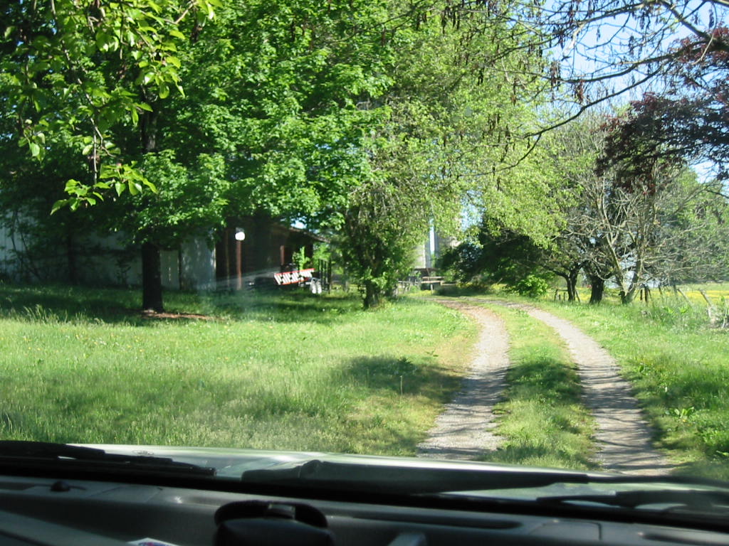 turn into the driveway of the house with the barn